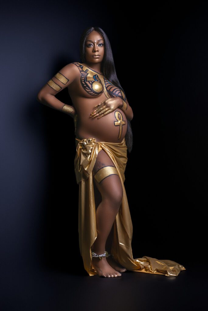Egyptian Inspired Maternity Session with symbols and vivid colors 