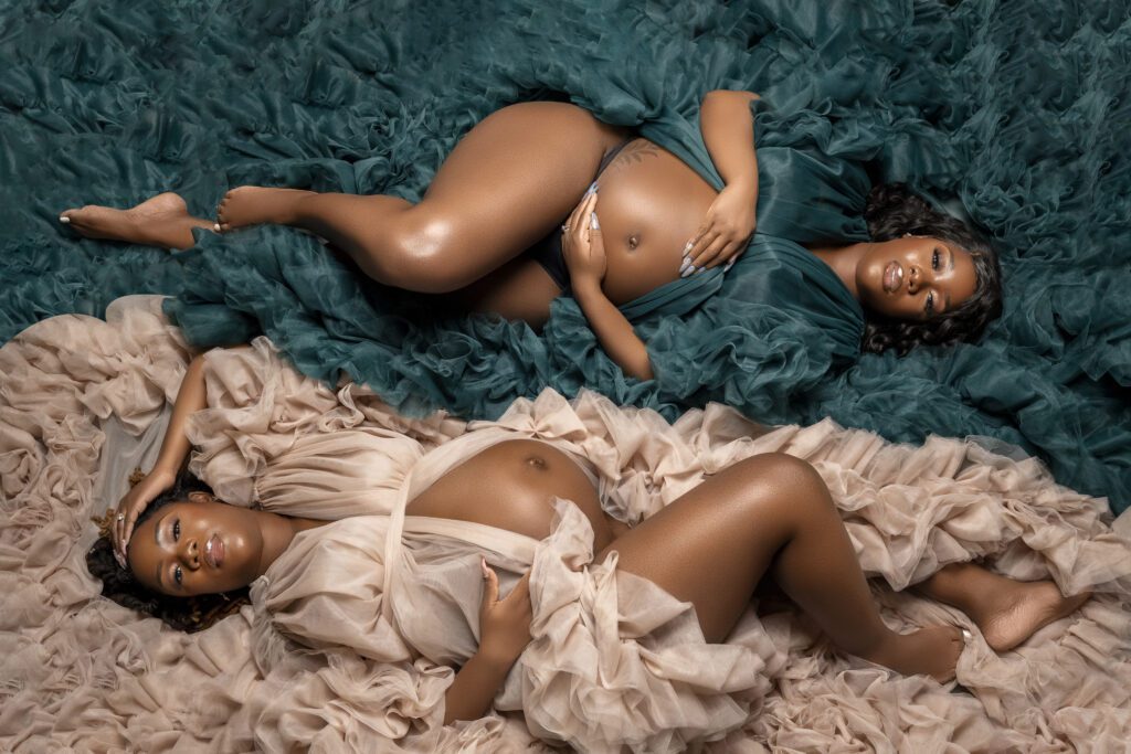 Twin sisters pose in tulle robes to distinguish the gender of their babies 